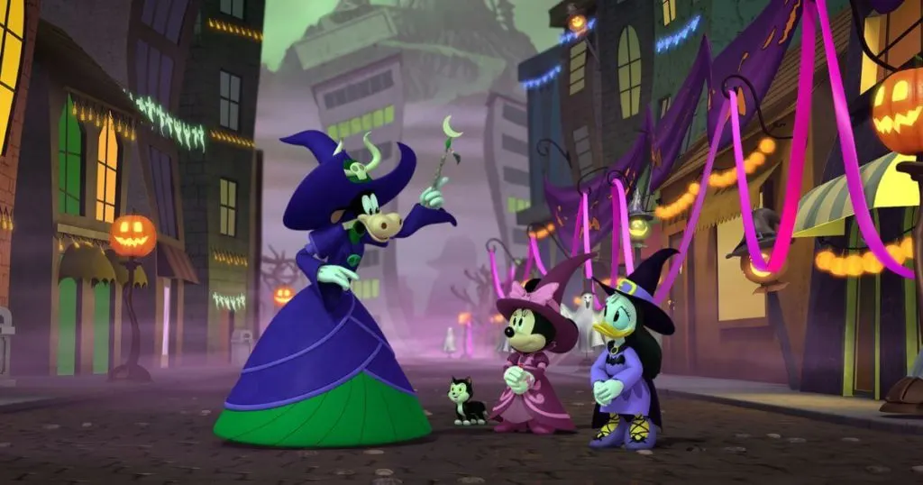 Photo still from Disney Junior's film, Mickey's Tale of Two Witches, featuring Clarabelle the Cow, Minnie Mouse, and Daisy Duck.