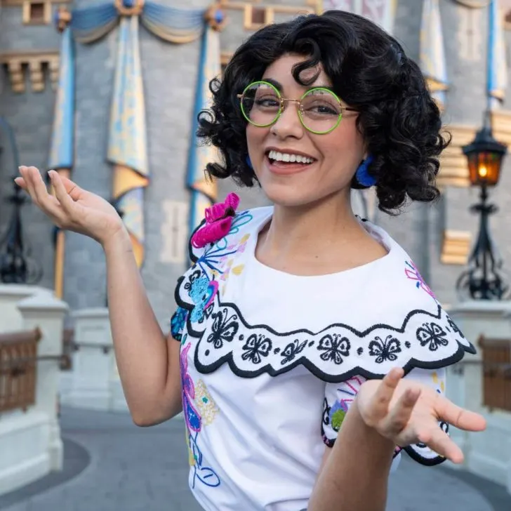 Closeup photo of Mirabel in front of Cinderella's Castle.