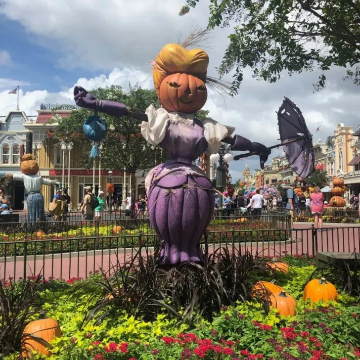 Photo of a faux scarecrow built out of pumpkins at Magic Kingdom.