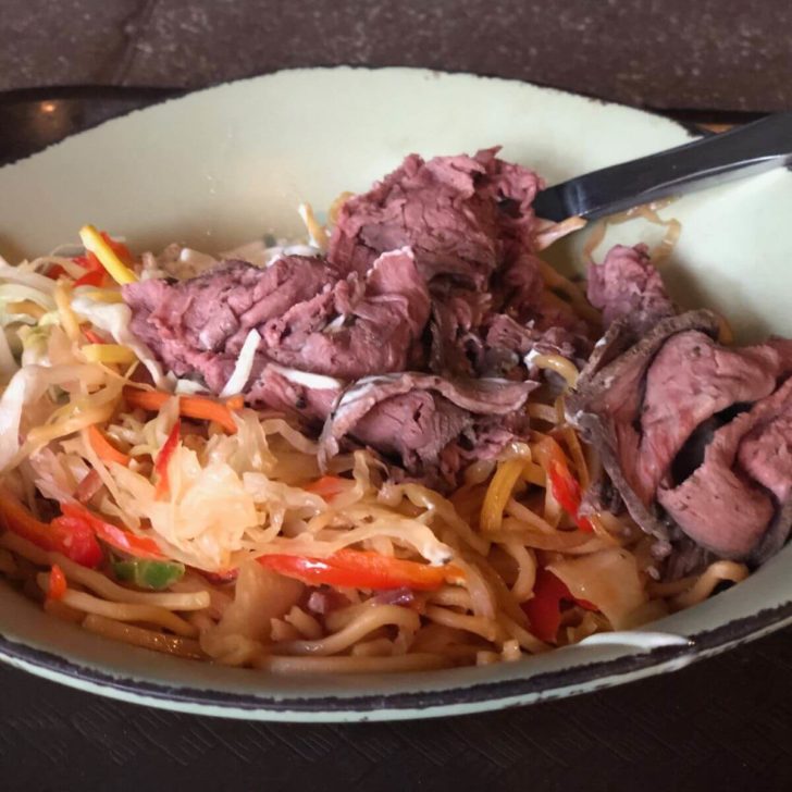 Closeup photo of a Satuli Canteen bowl with noodles, beef, boba, and more.