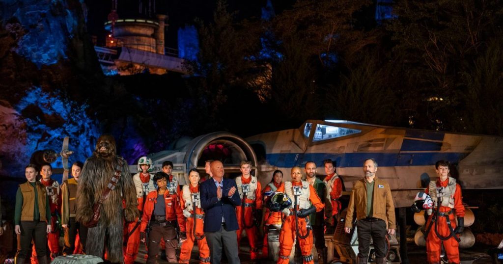 Photo of former Disney CEO Bob Chapek with a group of opening day cast members for Rise of the Resistance at Hollywood Studios.