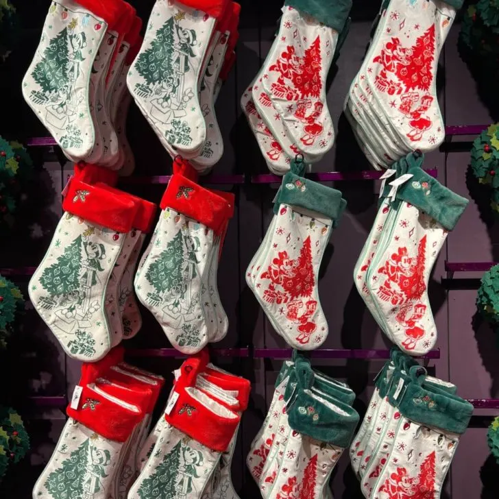 Closeup of Disney themed Christmas stockings on display at a store.