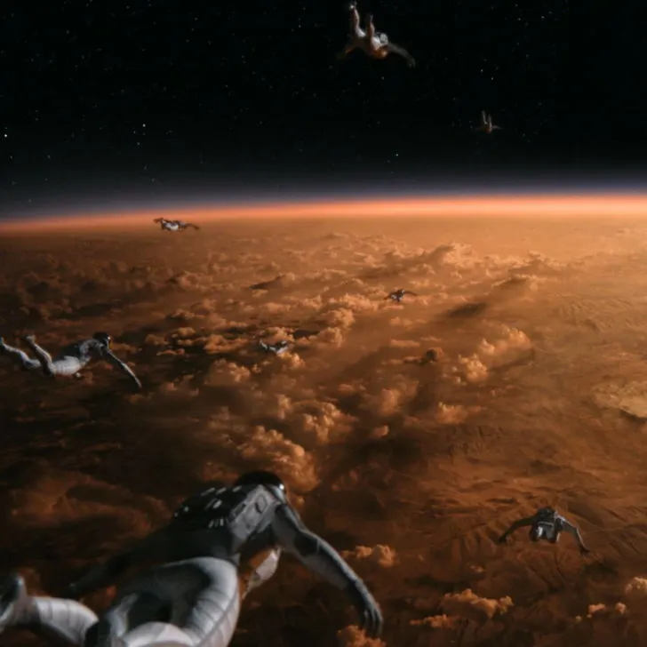 Photo still from the National Geographic show, Cosmos, featuring astronauts flying in space.