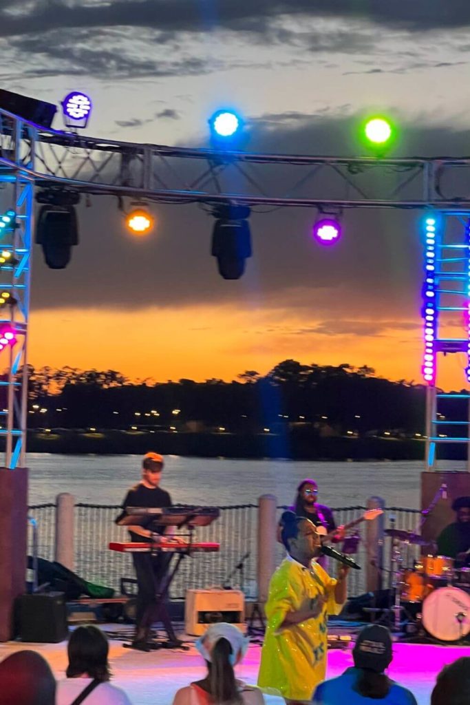 Photo of a band performing on a stage at Disney Springs.