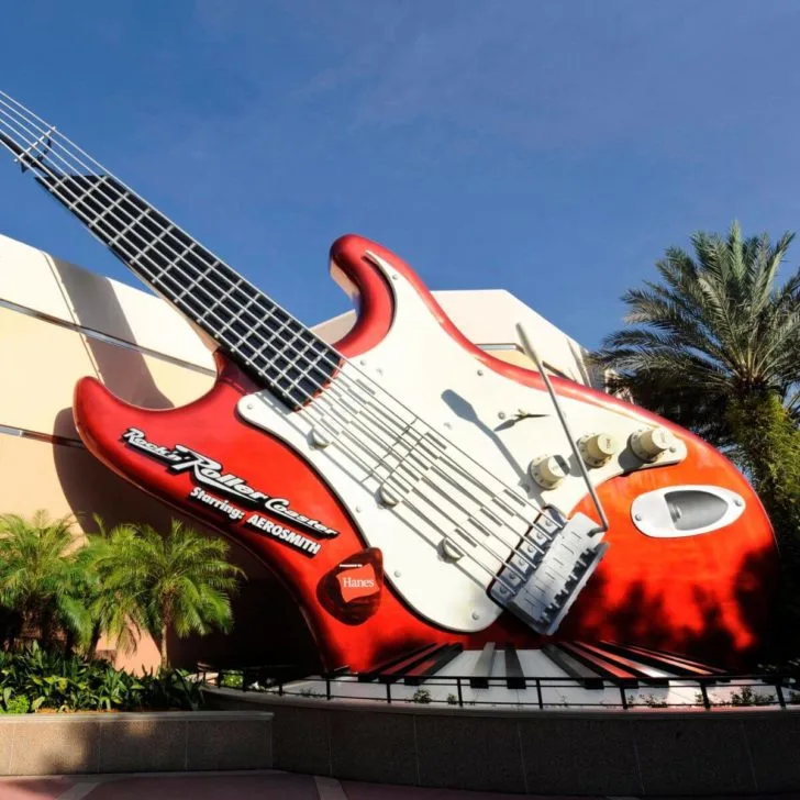 Photo of the giant red and white electric guitar outside the building for Rock n Roller Coaster Featuring Aerosmith.