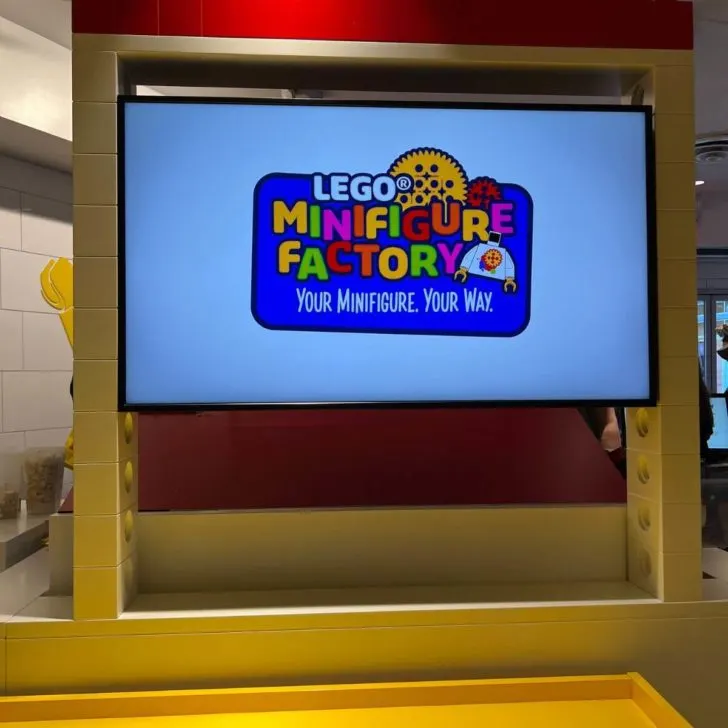 Photo of a LEGO minifigure factory kiosk at a LEGO store.