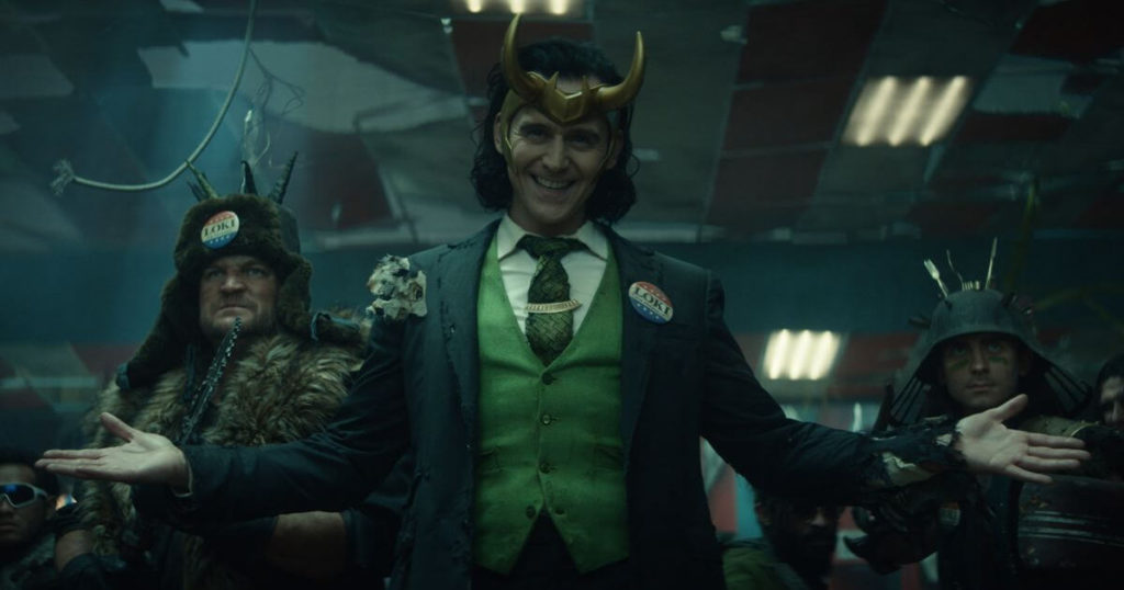 Promotional still from Loki, Season 1, Episode 5, featuring President Loki (Tom Hiddleston) and his crew.