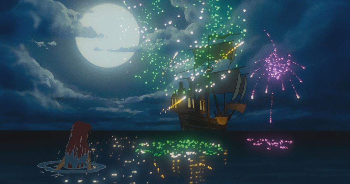 Photo still from The Little Mermaid with Ariel watching Eric's boat from the water while fireworks go off. The scene is also featured in the Zenimation episode, Discovery.