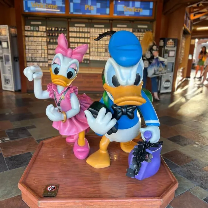 Photo of Daisy and Donald Duck statue at the trading pin store in Disney Springs.