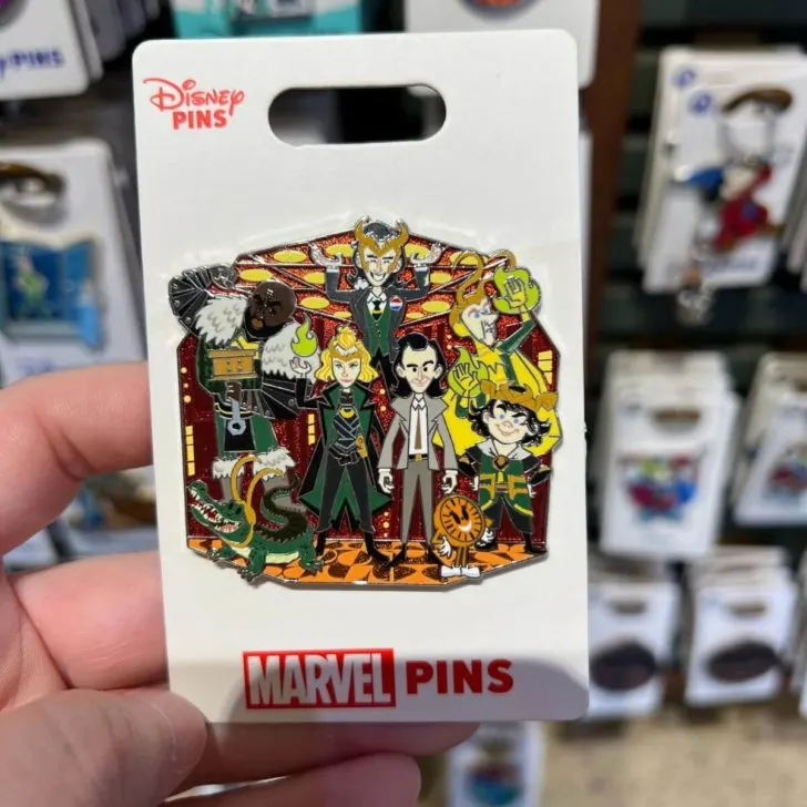 Closeup of a Loki series trading pin featuring Loki varients.