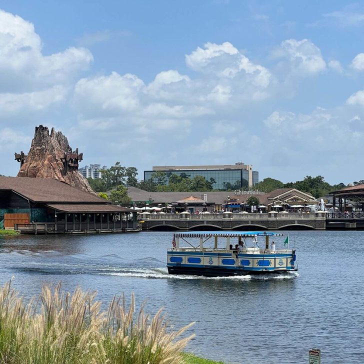 Photo of a sassagoula boat floating by with Rainforest Cafe and Ghirardelli in the background.