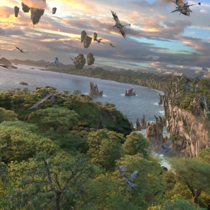 Photo still from the ride film portion of Avatar: Flight of Passage showing banshees flying through Pandora.