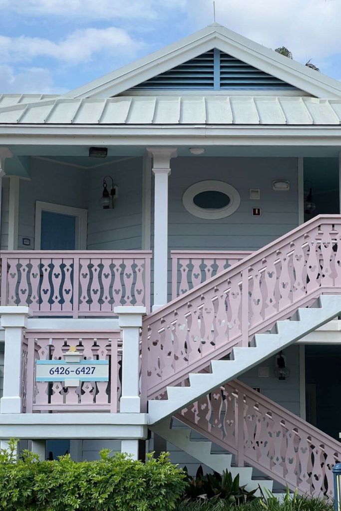 Photo of one of the buildings at Disney's Old Key West Resort with Mickey heads carved into the stair and balcony railings.
