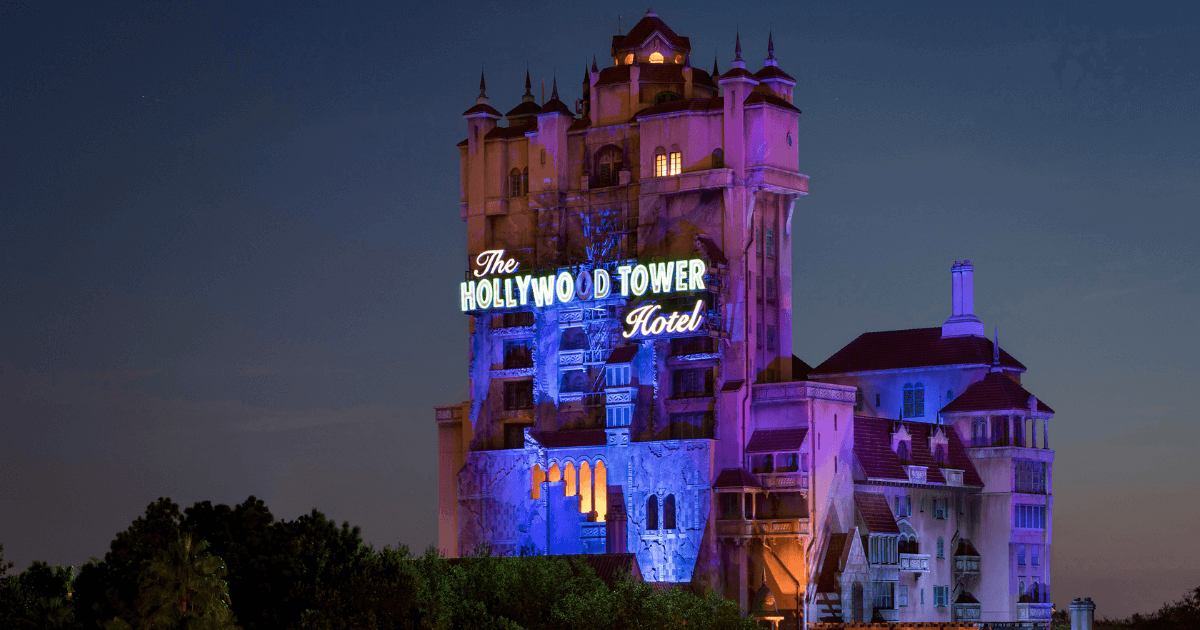 Horizontal photo of the Hollywood Tower Hotel ride at night, from a distance.