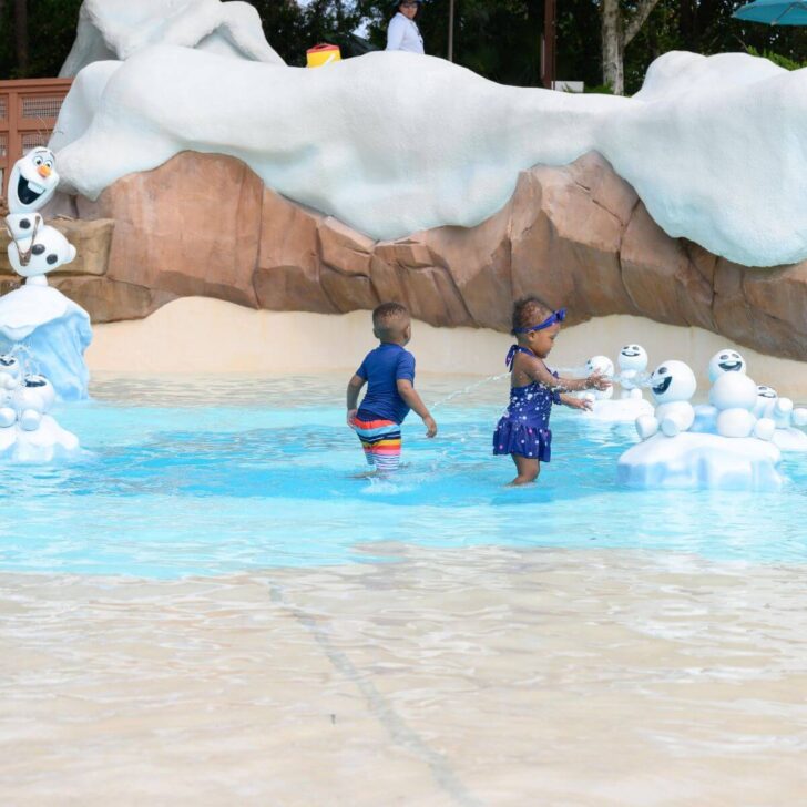 Photo of two toddlers playing at Blizzard Beach's Frozen-themed Tikes Peak.