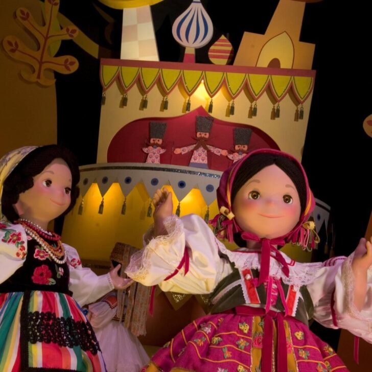 Photo of two dolls in a scene from the ride "It's a Small World," at Disney World.