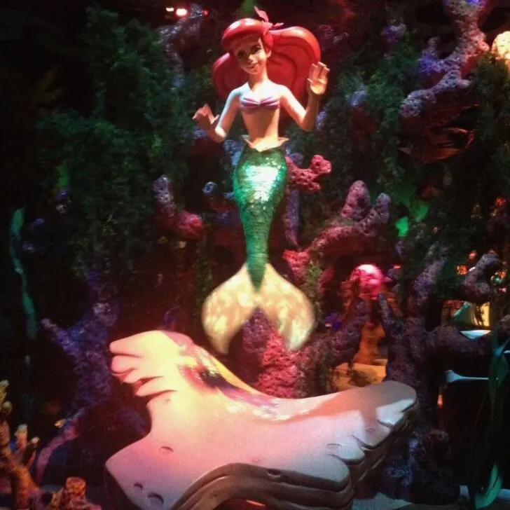 Photo of an Ariel mermaid statue in the Journey of the Little Mermaid ride.