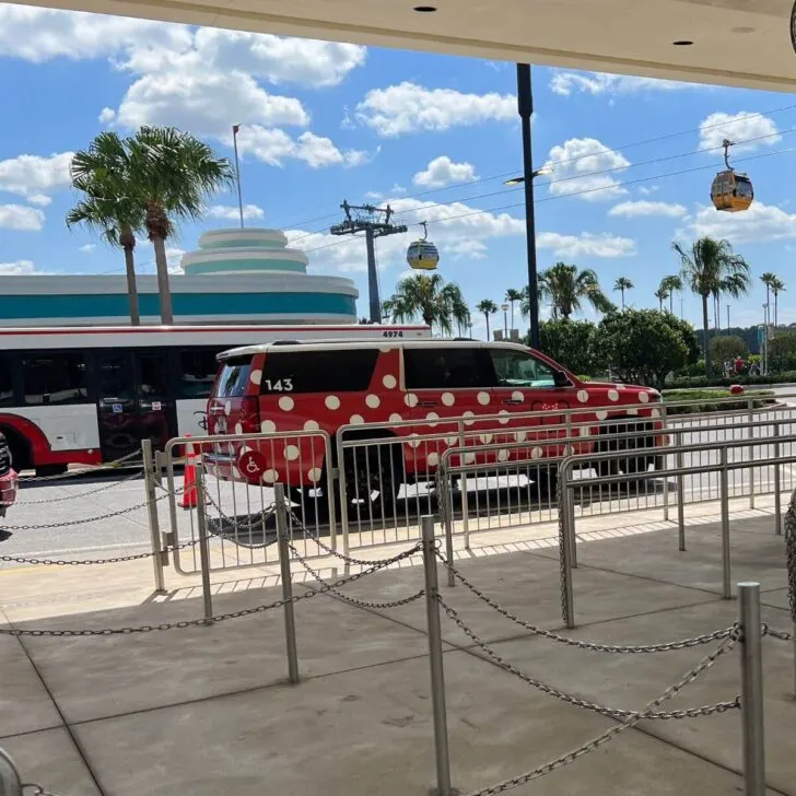Photo of a red SUV with white polka dots from the Disney World Minnie Van service with Lyft.