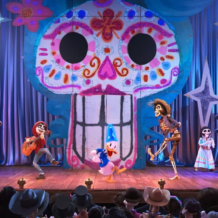 Photo of scene featuring characters from Pixar's Coco in Mickey's PhilharMagic show at Magic Kingdom.