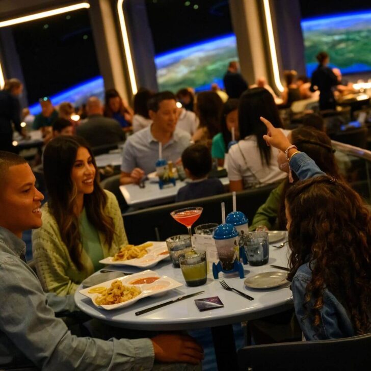 Photo of a family with 2 kids eating at the Space 220 restaurant at Epcot.