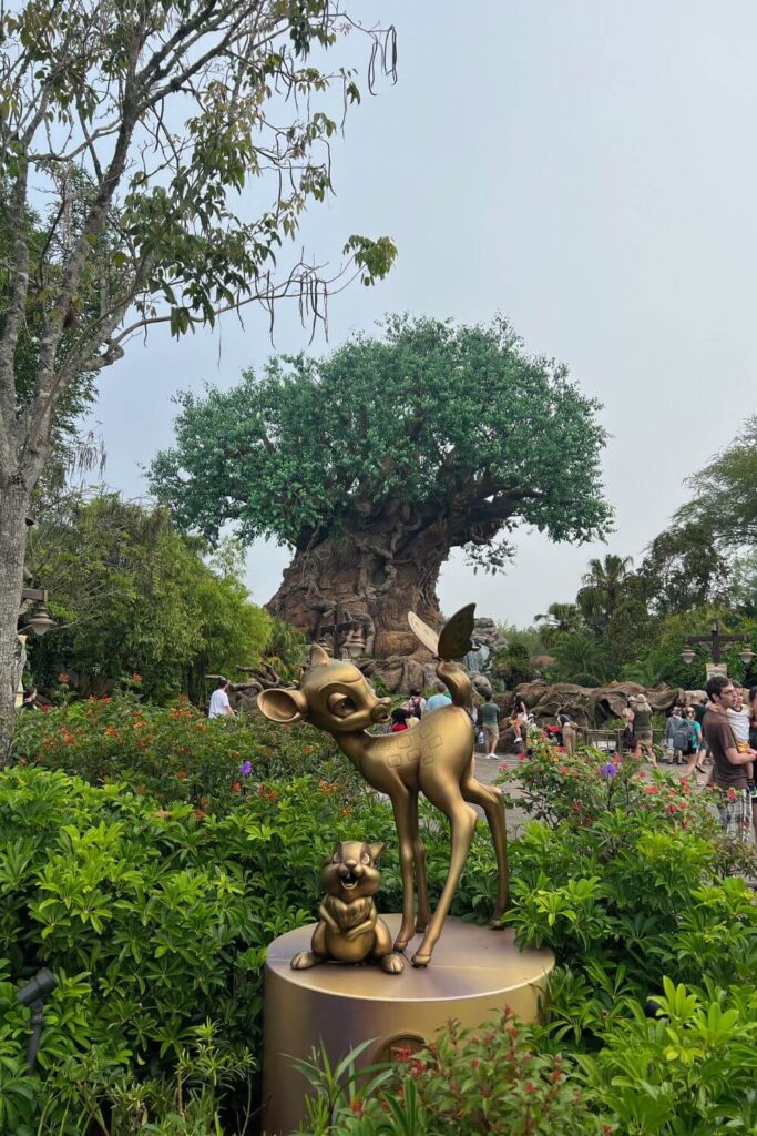 Photo of the Bambi and Thumper statue at Animal Kingdom with the Tree of Life in the background.