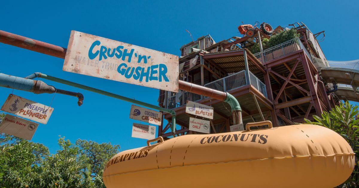 Photo of a large yellow tube slide float with a sign above it that says 