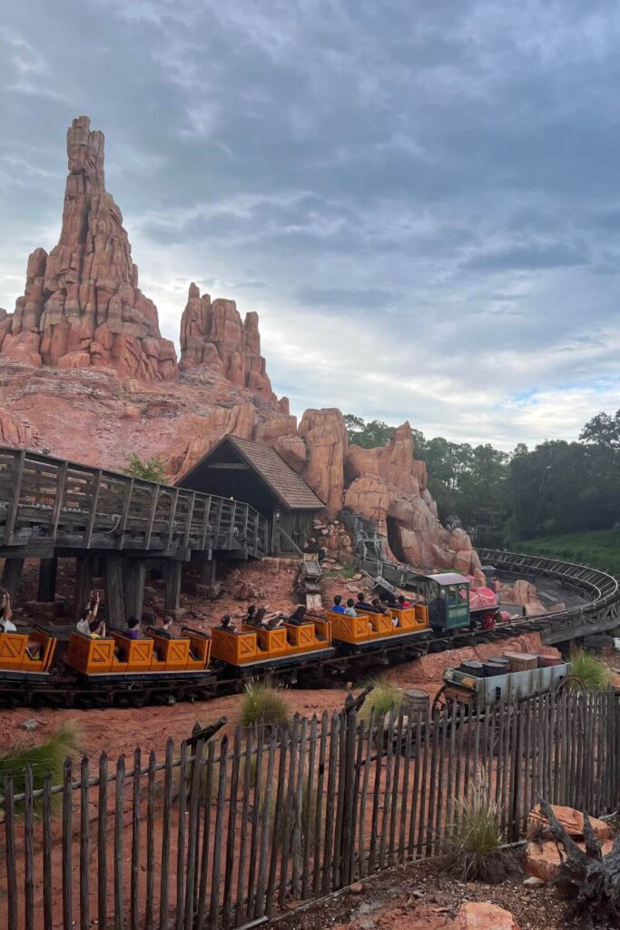 Photo of a ride car going by on Big Thunder Mountain Railroad roller coaster at Magic Kingdom.