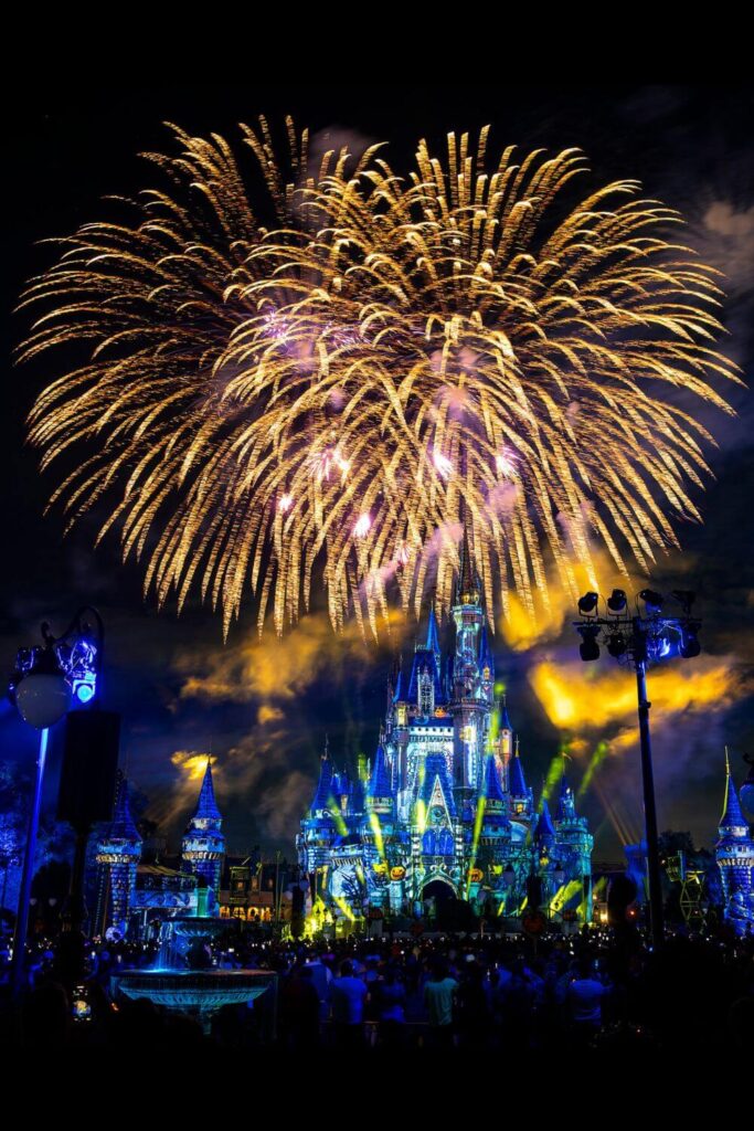 Photo of Disney's Not-So-Spooky Spectacular fireworks show Mickey's Not-So-Scary Halloween Party, with Cinderella's castle all lit up from.