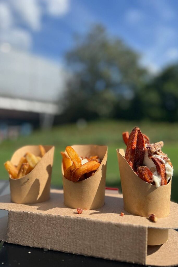 Photo of the French Fry Flight from The Fry Basket food booth at the 2023 Epcot Food and Wine Festival.