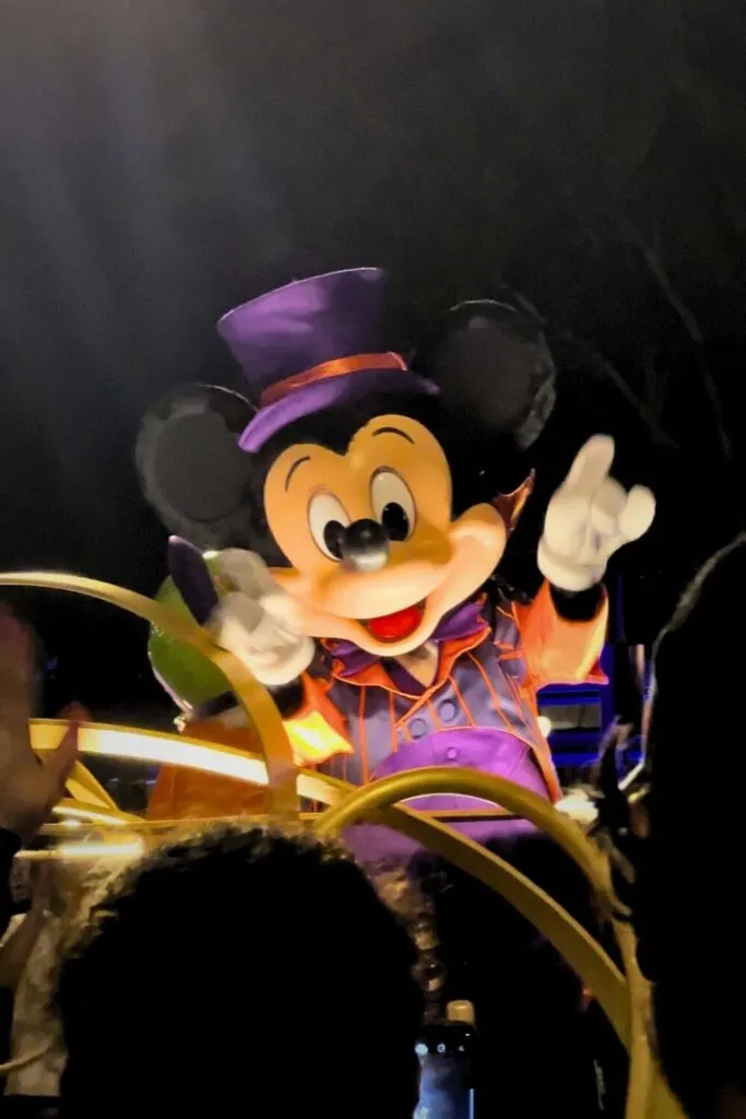 Closeup photo of Mickey Mouse dressed in a Halloween costume in the Boo-to-You Parade at Mickey's Not-So-Scary Halloween Party.