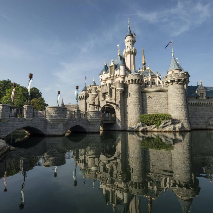 Photo of the Hong Kong Disneyland castle reflecting in the moat that surrounds it.