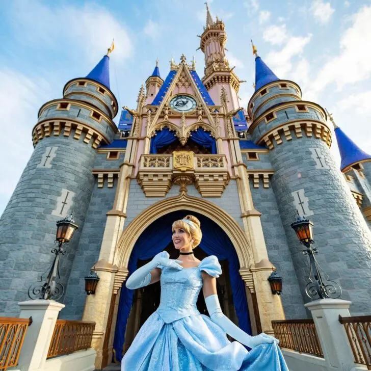 Photo of Cinderella posing in front of her castle at Disney World's Magic Kingdom.