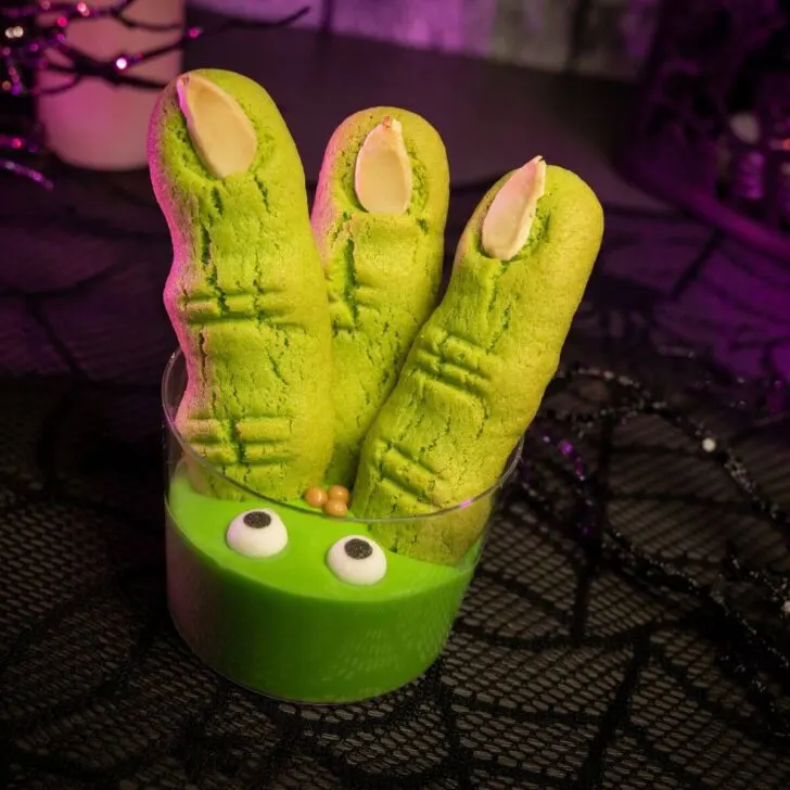 Photo of one of this year's Halloween treats at Mickey's Not So Scary Halloween Party with green cookies shaped like fingers in a pot of green pudding.