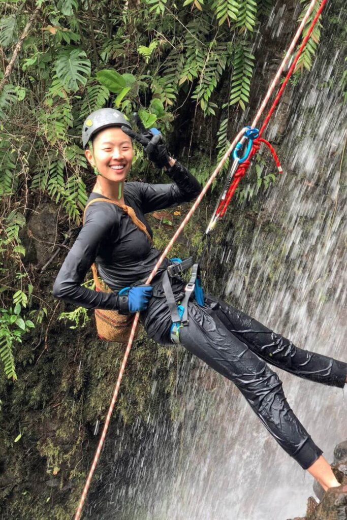 Chef Kristen Kish rappels down a waterfall to collect a type of fresh watercress which only grows in that particular location in Hacienda Mamecillo, Panama.