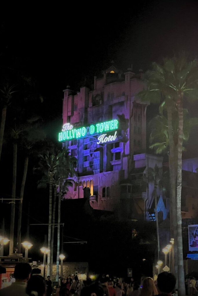 Photo of the Hollywood Tower Hotel looking down Sunset Boulevard in Hollywood Studios at night.