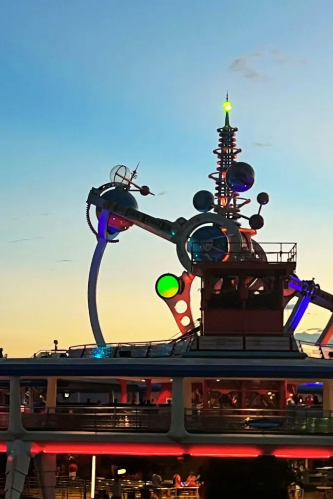 Photo of the Astro Orbiter ride at Magic Kingdom during sunset.