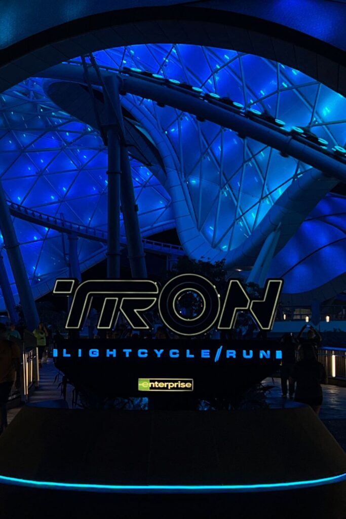 Photo of the entrance of TRON Lightcycle/Run at Magic Kingdom, with the ride in the background.