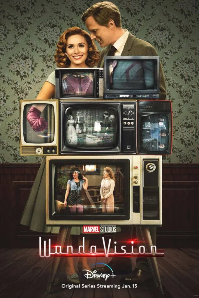 Promotional poster for the Marvel Studios limited series, WandaVision, with Wanda Maximoff and Vision standing behind a tower of televisions from the 1950s.