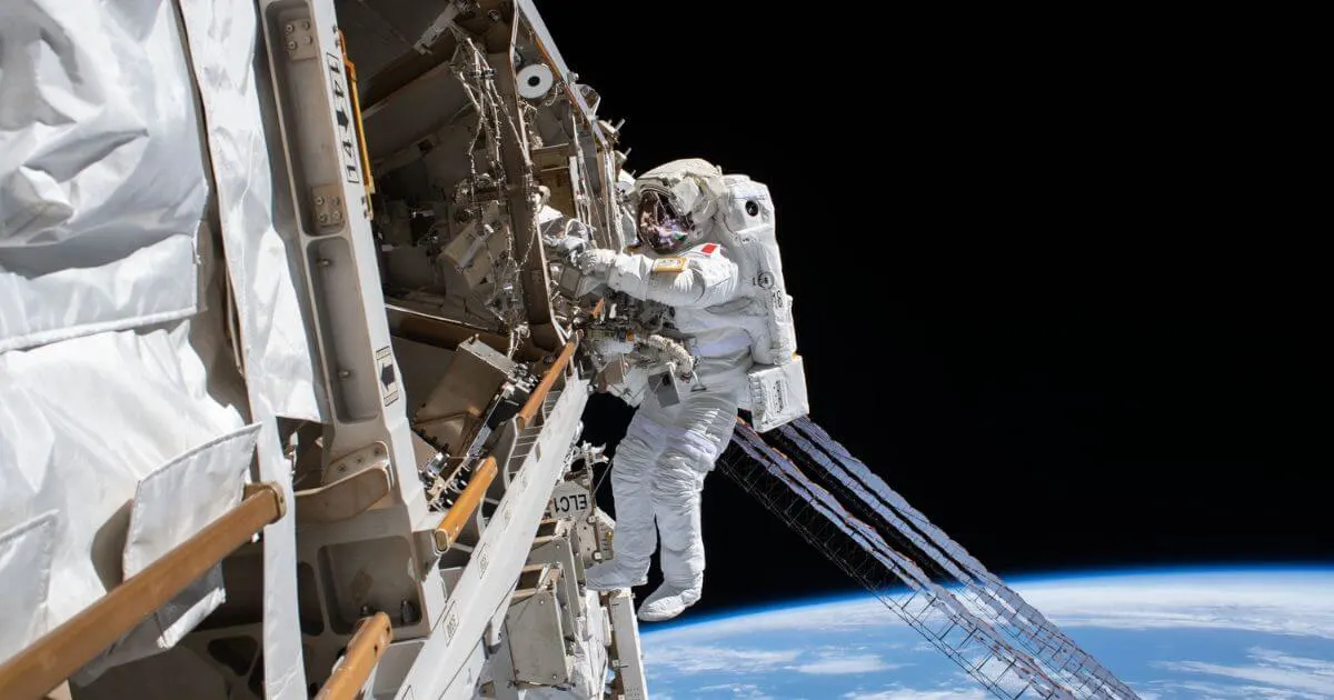 ESA (European Space Agency) astronaut Luca Parmitano is pictured tethered to the International Space Station while finalizing thermal repairs on the Alpha Magnetic Spectrometer.