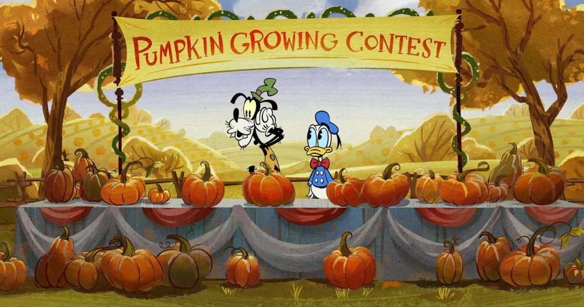 Photo still from The Wonderful Autumn of Mickey Mouse, featuring Goofy and Donald Duck at a table filled with pumpkins that has a sign overhead that reads: Pumpkin Growing Contest.