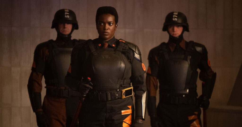 Promotion photo featuring Wunmi Mosaku as Hunter B-15 (Center), and 2 unknown TVA hunters flanking her, in Marvel Studios' LOKI, Season 2, Episode 1.