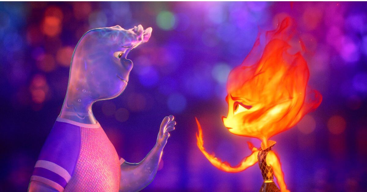 Photo still from the animated film, Elemental, featuring the main characters, (L-R) Wade and Ember, holding their hands up to each other.