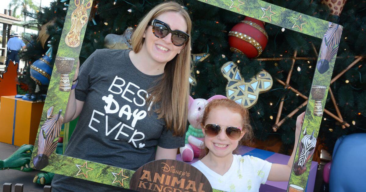 Photo of Meg Frost and niece in front of Disney's Animal Kingdom Christmas tree.