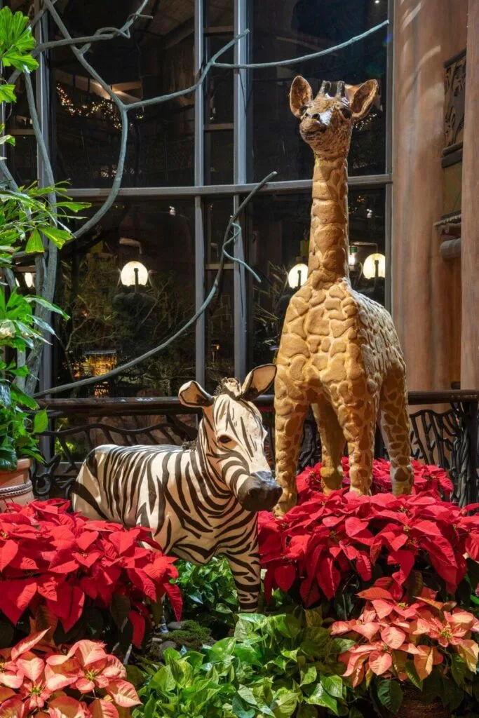 Photo of a life size giraffe and zebra made out of gingerbread at Disney's Animal Kingdom Lodge - Jambo House lobby.