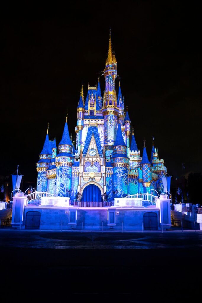 Photo of Cinderella's Castle during the Frozen Holiday Surprise nighttime show at Magic Kingdom.