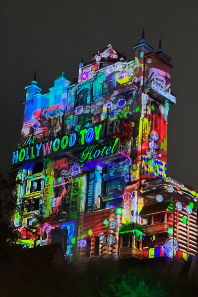Photo of the Christmas projection show on the Hollywood Tower Hotel, which transforms it to The Hollywood Toy Hotel.