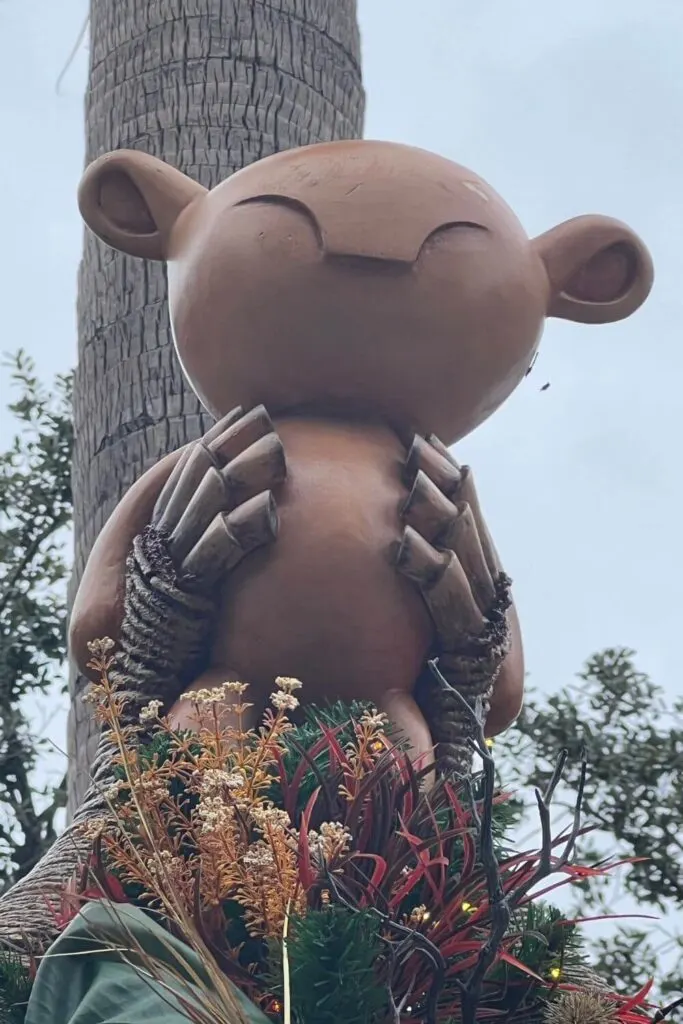 Closeup of a Simba tree topper on a Lion King tree at Disney Springs.