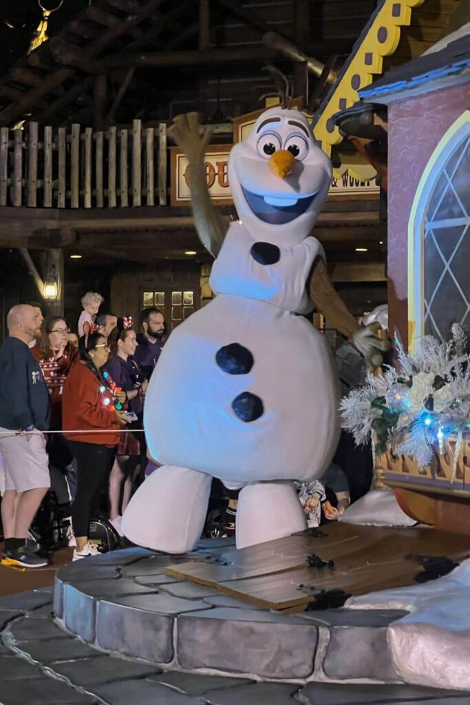 Photo of Olaf on a float during the parade at Mickey's Very Merry Christmas Party.