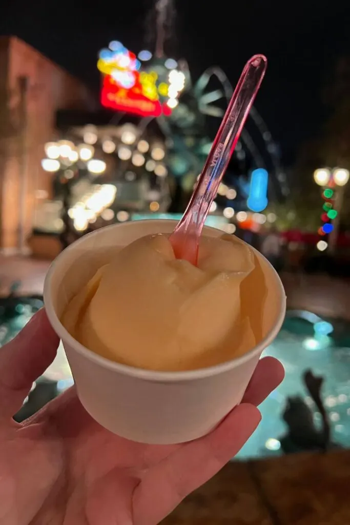 Photo of one scoop of POG gelato from the gelato cart next to the Muppets 3-D Show at Hollywood Studios.