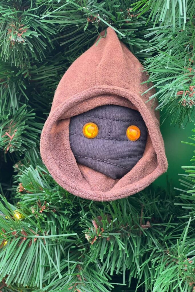 Closeup of a Jawa Christmas tree ornament from Star Wars.